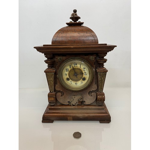 98 - Oak cased mantle clock with brass decoration.

This lot is available for in-house shipping