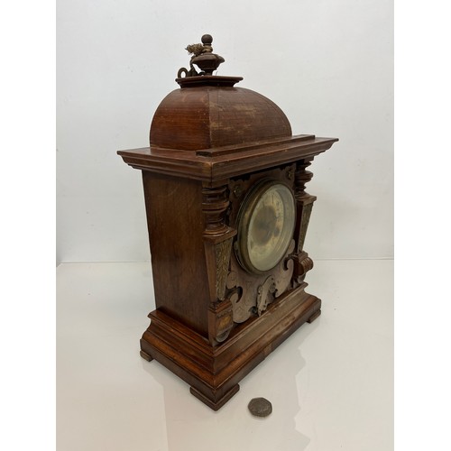 98 - Oak cased mantle clock with brass decoration.

This lot is available for in-house shipping