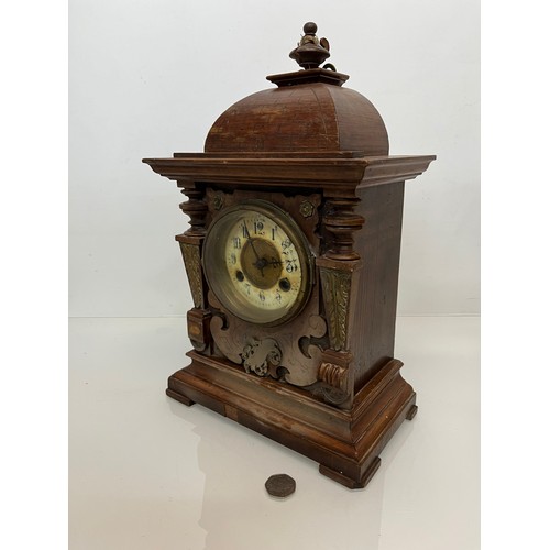 98 - Oak cased mantle clock with brass decoration.

This lot is available for in-house shipping