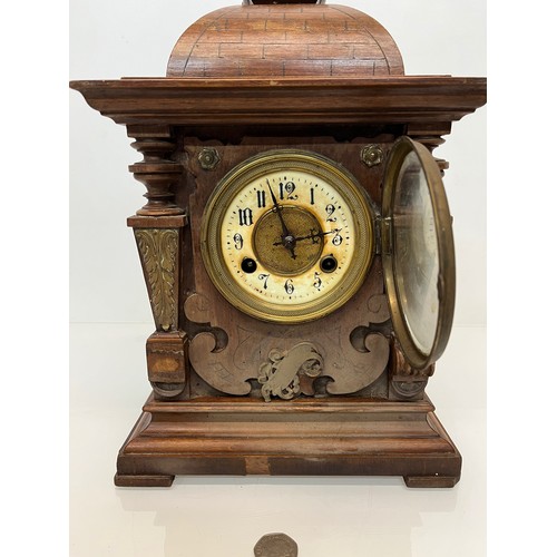 98 - Oak cased mantle clock with brass decoration.

This lot is available for in-house shipping