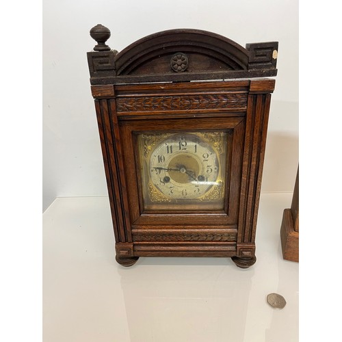 99 - Two early C20th wooden cased mantle clocks.

This lot is available for in-house shipping