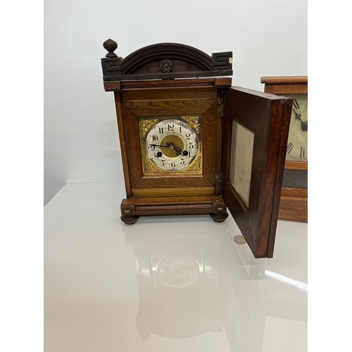 99 - Two early C20th wooden cased mantle clocks.

This lot is available for in-house shipping