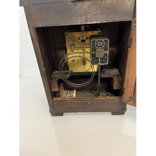 99 - Two early C20th wooden cased mantle clocks.

This lot is available for in-house shipping