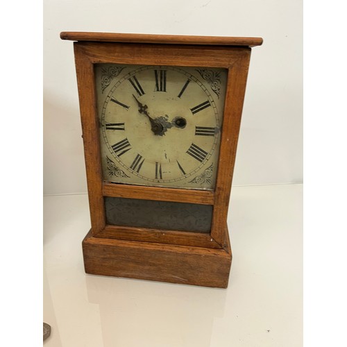 99 - Two early C20th wooden cased mantle clocks.

This lot is available for in-house shipping