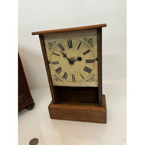 99 - Two early C20th wooden cased mantle clocks.

This lot is available for in-house shipping