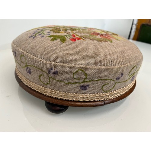 105 - Antique furniture, a circular foot stool with decorative needlework  top and sides, 12 inches in dia... 