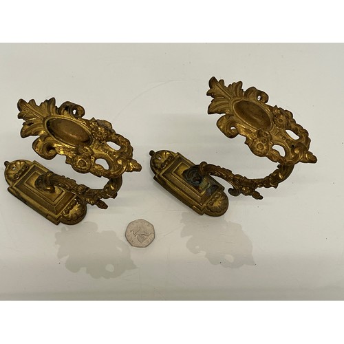 110 - Pair of Brass curtain tie backs the finials are 10cm high.

This lot is available for in-house shipp... 