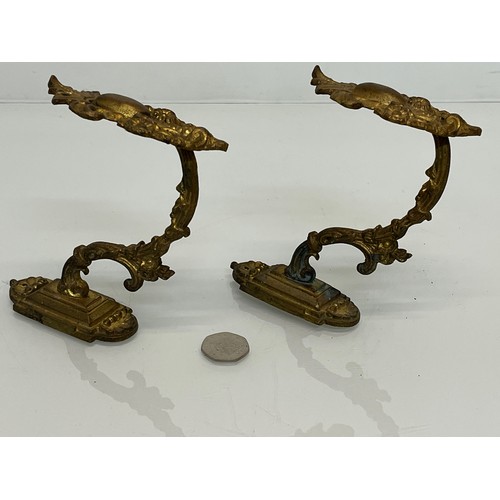 110 - Pair of Brass curtain tie backs the finials are 10cm high.

This lot is available for in-house shipp... 