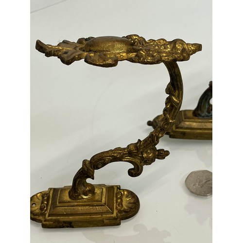 110 - Pair of Brass curtain tie backs the finials are 10cm high.

This lot is available for in-house shipp... 