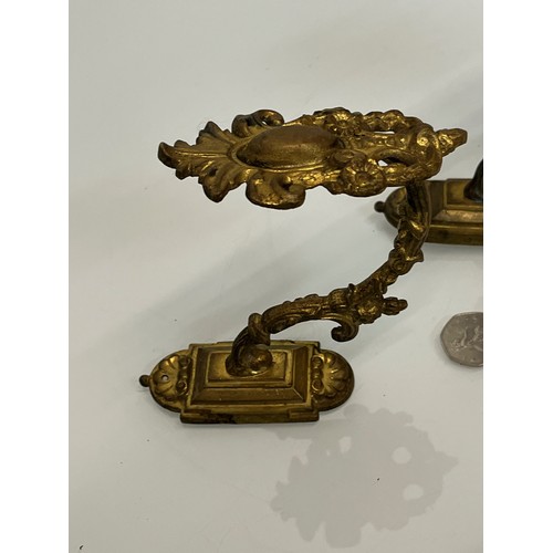 110 - Pair of Brass curtain tie backs the finials are 10cm high.

This lot is available for in-house shipp... 