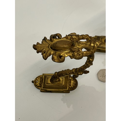 110 - Pair of Brass curtain tie backs the finials are 10cm high.

This lot is available for in-house shipp... 