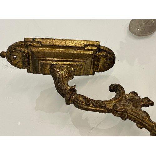 110 - Pair of Brass curtain tie backs the finials are 10cm high.

This lot is available for in-house shipp... 