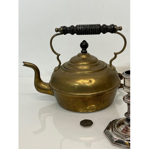 114 - Mixed metal wares, Plated art deco candle stand, brass kettle and a cast brass light fitting.

This ... 