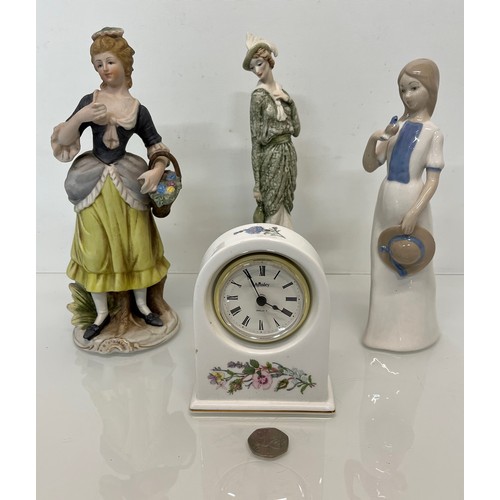 119 - Mixed items, a ceramic cased clock and three figurines.

This lot is available for in-house shipping