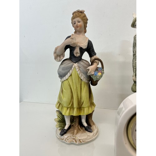 119 - Mixed items, a ceramic cased clock and three figurines.

This lot is available for in-house shipping