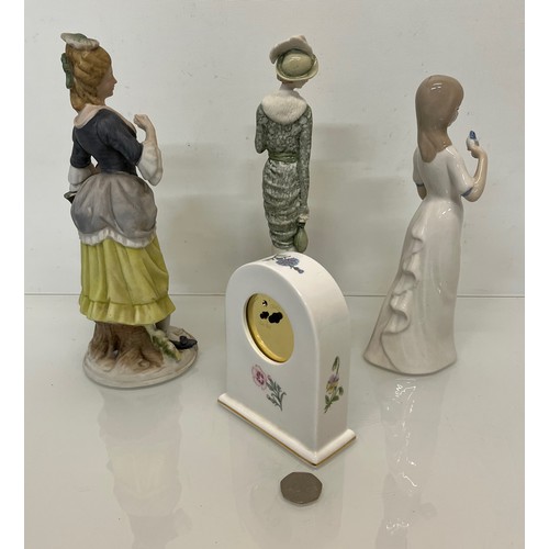 119 - Mixed items, a ceramic cased clock and three figurines.

This lot is available for in-house shipping