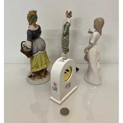 119 - Mixed items, a ceramic cased clock and three figurines.

This lot is available for in-house shipping