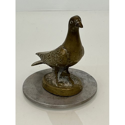 129 - Automobilia, a cast motor car mascot in the form of a Pidgeon.

This lot is available for in-house s... 