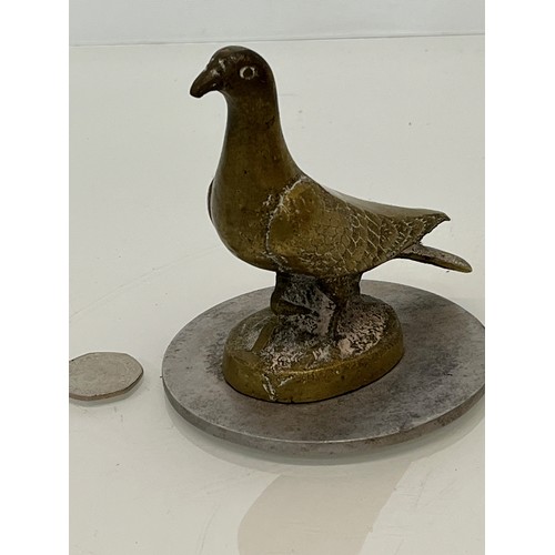 129 - Automobilia, a cast motor car mascot in the form of a Pidgeon.

This lot is available for in-house s... 