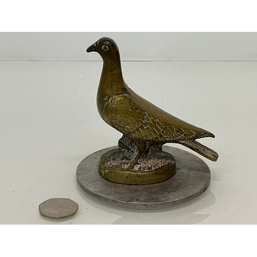 129 - Automobilia, a cast motor car mascot in the form of a Pidgeon.

This lot is available for in-house s... 