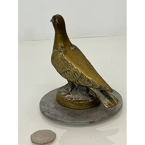 129 - Automobilia, a cast motor car mascot in the form of a Pidgeon.

This lot is available for in-house s... 