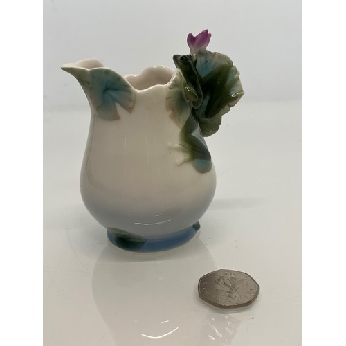 134 - Franz pottery, a Jug with floral decoration. 

This lot is available for in-house shipping