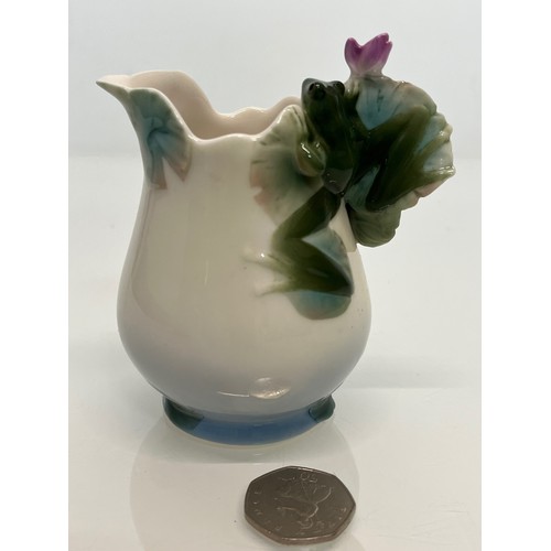 134 - Franz pottery, a Jug with floral decoration. 

This lot is available for in-house shipping