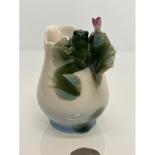 134 - Franz pottery, a Jug with floral decoration. 

This lot is available for in-house shipping