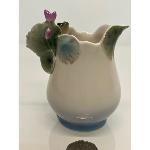 134 - Franz pottery, a Jug with floral decoration. 

This lot is available for in-house shipping