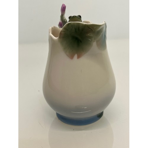 134 - Franz pottery, a Jug with floral decoration. 

This lot is available for in-house shipping