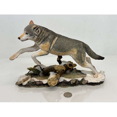 138 - A figurine of a leaping Wolf, 36 cm long, 23 cm high.

This lot is available for in-house shipping