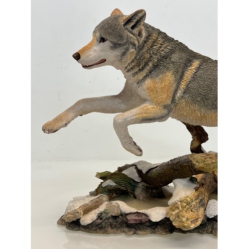 138 - A figurine of a leaping Wolf, 36 cm long, 23 cm high.

This lot is available for in-house shipping