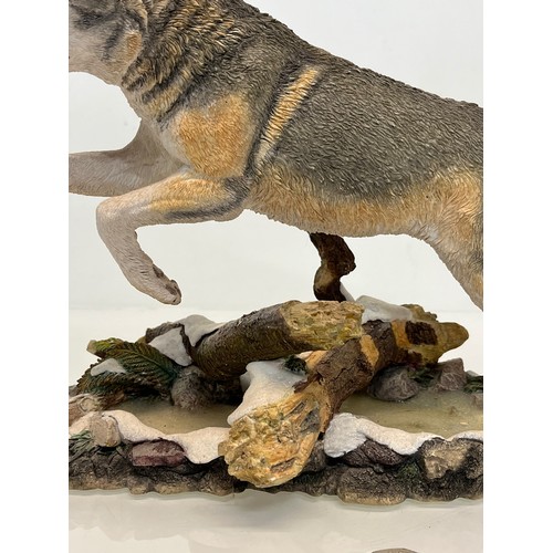 138 - A figurine of a leaping Wolf, 36 cm long, 23 cm high.

This lot is available for in-house shipping