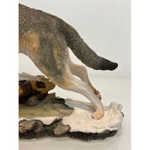 138 - A figurine of a leaping Wolf, 36 cm long, 23 cm high.

This lot is available for in-house shipping