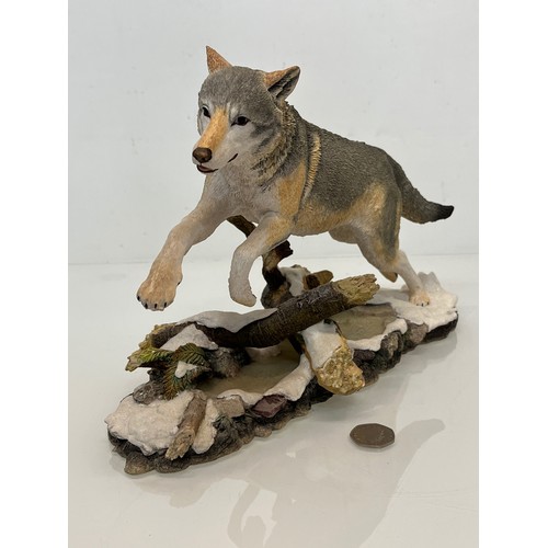 138 - A figurine of a leaping Wolf, 36 cm long, 23 cm high.

This lot is available for in-house shipping