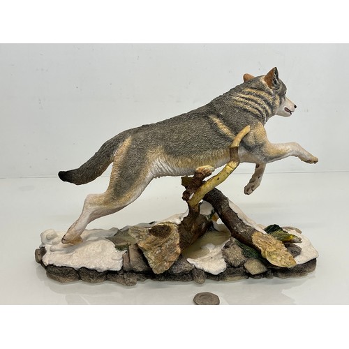 138 - A figurine of a leaping Wolf, 36 cm long, 23 cm high.

This lot is available for in-house shipping