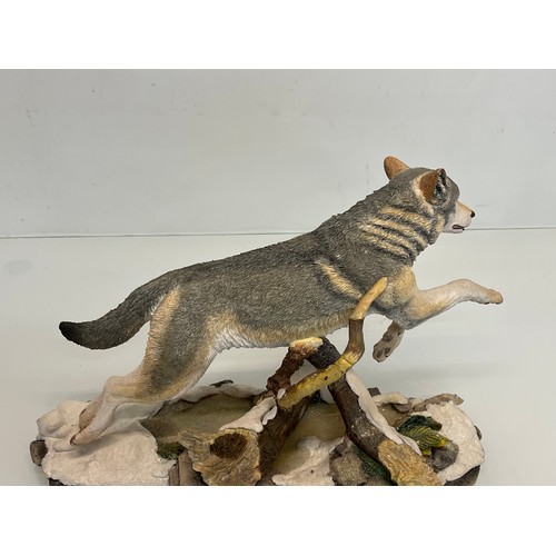 138 - A figurine of a leaping Wolf, 36 cm long, 23 cm high.

This lot is available for in-house shipping