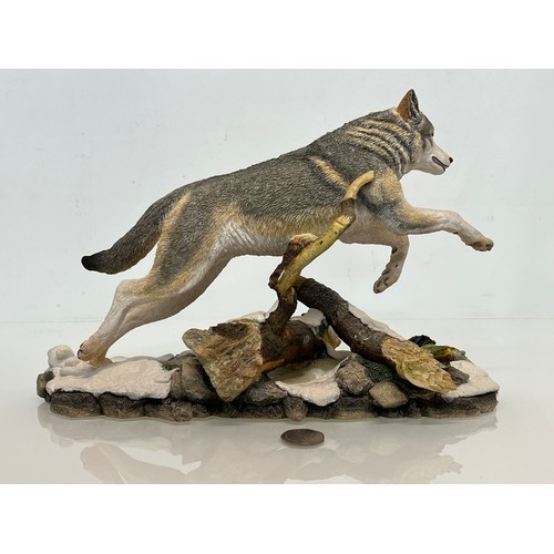 138 - A figurine of a leaping Wolf, 36 cm long, 23 cm high.

This lot is available for in-house shipping