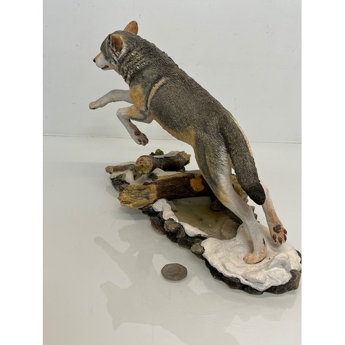 138 - A figurine of a leaping Wolf, 36 cm long, 23 cm high.

This lot is available for in-house shipping