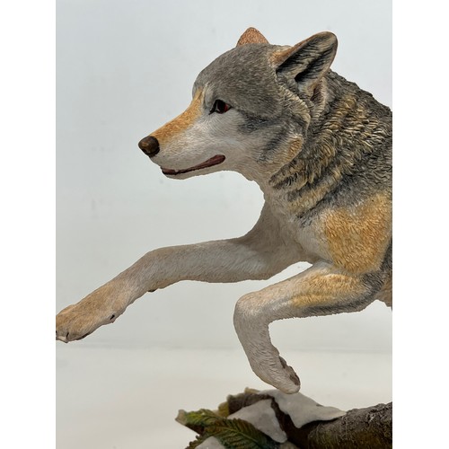 138 - A figurine of a leaping Wolf, 36 cm long, 23 cm high.

This lot is available for in-house shipping