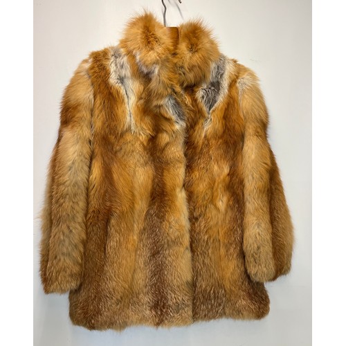 92 - Ladies fur coat marked for German fashion house.
No specific sizing marked on the coat.

Arm pit to ... 