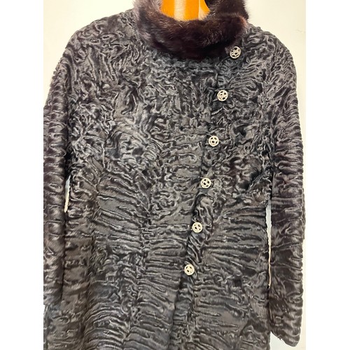 97 - Ladies full length fur coat, marked for south west African lamb, Swiss furriers mark.

This lot is a... 