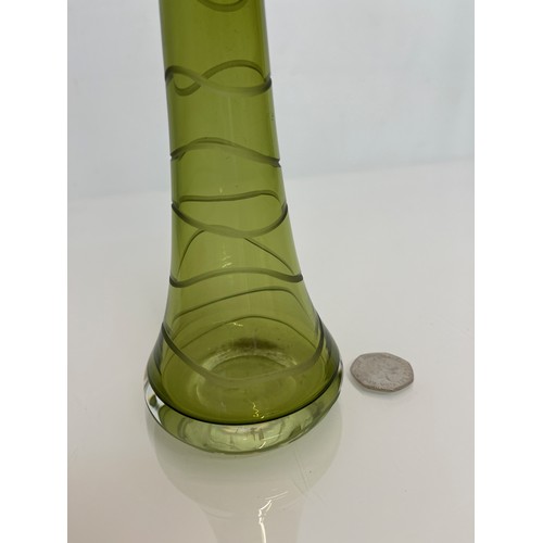 436 - Mid century green art glass vase with wheel cut decoration. 23 cm high

This lot is available for in... 