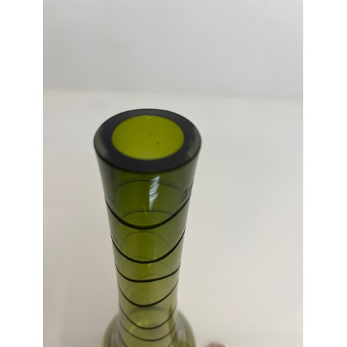 436 - Mid century green art glass vase with wheel cut decoration. 23 cm high

This lot is available for in... 