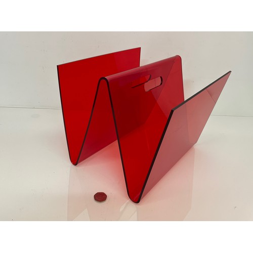 115 - Mid century designer furniture, a transparent red Perspex magazine stand.

This lot is available for... 