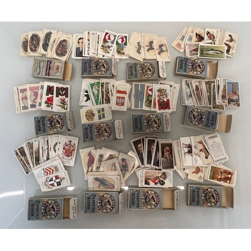 118 - Collection of Smoking ephemera, 12 Players Navy Cut boxes containing a collection of cigarette cards... 