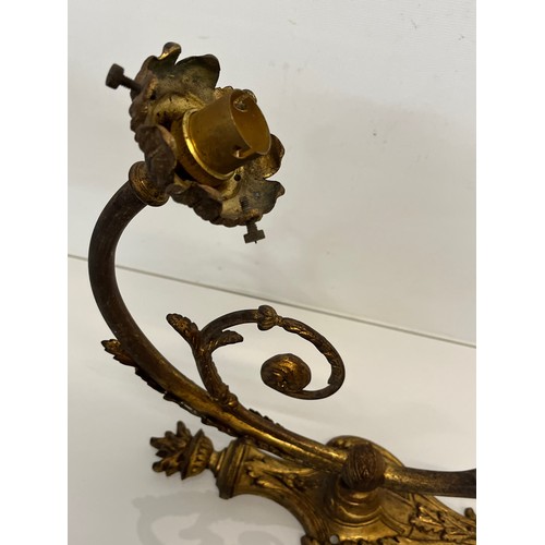 191 - Pair of gilded cast brass decorative light sconces.

This lot is available for in-house packing and ... 