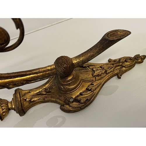 191 - Pair of gilded cast brass decorative light sconces.

This lot is available for in-house packing and ... 