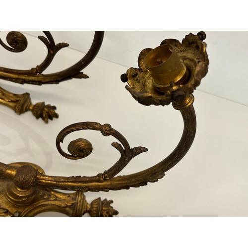 191 - Pair of gilded cast brass decorative light sconces.

This lot is available for in-house packing and ... 