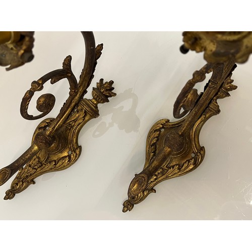 191 - Pair of gilded cast brass decorative light sconces.

This lot is available for in-house packing and ... 